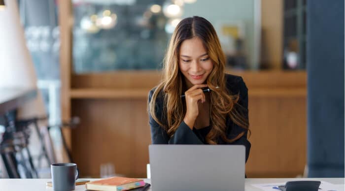 Board Admin looks through BoardEffect alternatives on her laptop.